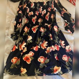 Dark blue w pink/peachy flowers . Off the shoulders